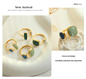 Detail of adjustable gold-plated steel rings with colorful enamel square textures