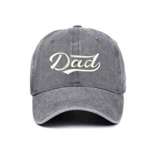 Close-up of Dad embroidery on washed grey cotton baseball cap with detailed stitching