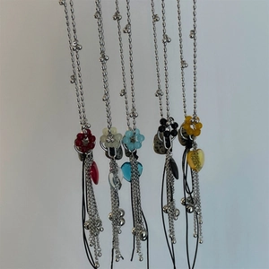 Y2K style beaded pendant necklace with colorful flowers and metal tassels on silver bead chain