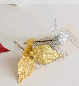 Macro detail of gold and silver glittered artificial leaves for Christmas tree decoration