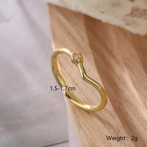 Close-up of wavy 18K gold plated copper ring with zircon inlay and adjustable size