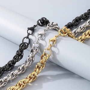 Detailed view of twisted rope chains in black, silver, and gold stainless steel finishes