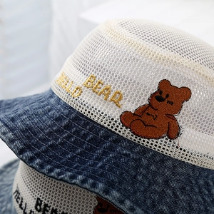 Kids denim mesh bucket hat with blue brim and embroidered Hello Bear pattern