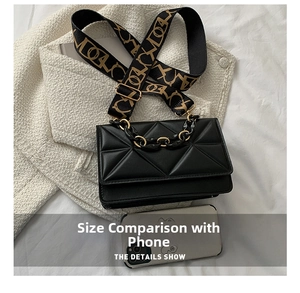 Quilted diamond pattern bag detail with gold-toned chain handle and wide strap