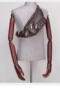 Detail of dark brown faux crocodile leather chest bag shown on a mannequin torso