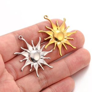 Vintage stainless steel sunflower pendants in gold and silver finish shown on hand