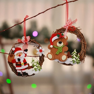 Close-up of festive Santa Claus and bear characters on handmade Christmas vine wreaths