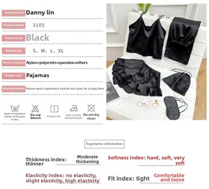 Detailed set of black satin loungewear including camisole, pants, eye mask, and bag