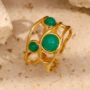 Bohemian 18K gold plated stainless steel open ring with three green stones on natural stone