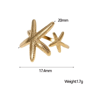Macro shot of gold starfish ring showing detailed grain texture and 20mm dimensions