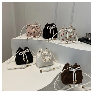 Stylish corduroy drawstring bucket bag with strawberry print and sweet bow detail