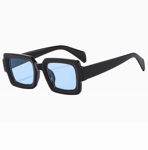 Side view of retro square sunglasses with thick black frames and light blue tinted lenses