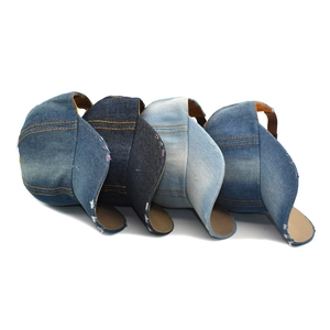 Distressed denim baseball caps in four vintage washes with contrast stitching and worn edges