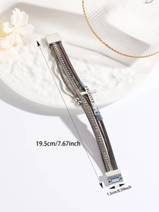 Detail showing Bohemian multi-layer leather bracelet with cross and shiny rhinestones
