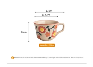 Close-up of ceramic coffee mug with floral pattern and dimensions showing 330ml capacity