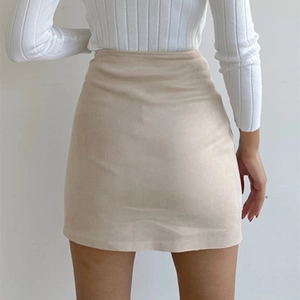 Rear view of stylish apricot faux suede mini skirt with high-waisted button-down detail