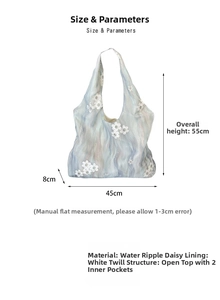 Detail view of light blue daisy embroidery canvas tote bag with 45x8x55cm dimensions