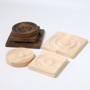Minimalist wooden display trays for jewelry in round and square shapes with wood grain