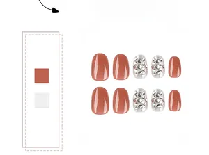 Macro detail of brick red press-on nails with silver glitter and sparkling rhinestones