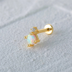 Macro view of 925 sterling silver opal labret stud with gold plating and white zircon stone