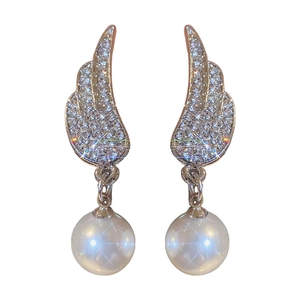Elegant silver wing earrings with sparkling zircon stones and starburst pearl pendants