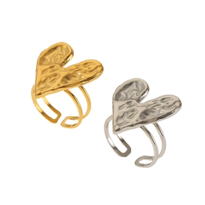 Lava heart rings in gold and silver, featuring a unique textured finish and open band design