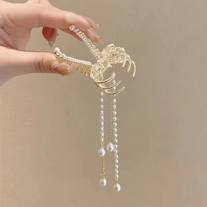 Elegant gold butterfly hair claw clip with white pearls and long tassel tassels