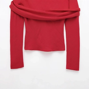 Slim fit red off-shoulder chiffon top with elegant pleated texture and long sleeves