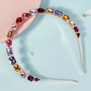 Close-up of elegant metal headband with colorful rhinestone wheat ear crystals