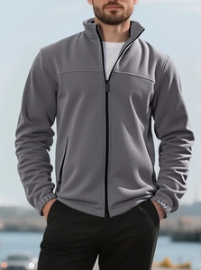 Close-up of gray heavy fleece sweatshirt showing thick texture and stand-up collar