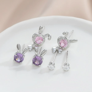 Lot de trois paires de boucles d'oreilles lapin en argent et pierres violettes