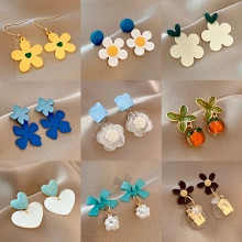 Selection of nine elegant floral earrings with pearls and colorful resin details