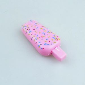 Close-up of pink mini ice cream toy pen with colorful sprinkles and a steady pink base