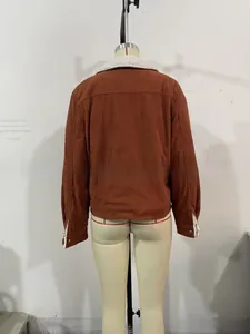 Rear view of brown corduroy jacket with white fleece collar and button cuffs