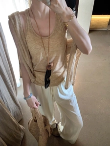 Detail of earthy tone sleeveless racerback tank top and matching shawl in linen texture