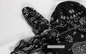 Detail of the high-quality paisley print and tight edge stitching on the black turban hat