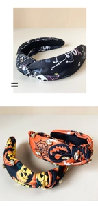 Close-up of handmade Halloween knotted headbands with pumpkin and spider web rhinestones