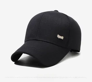 Detail of classic black cotton baseball cap with silver Sport metal logo on side profile