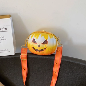 Detail view of pumpkin crossbody bag featuring orange gradient PU leather and wide strap