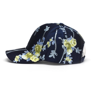 Detailed embroidery view of floral pattern on dark blue canvas baseball cap for women