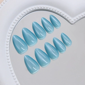 Icy blue cat-eye almond press-on nails with shimmering magnetic jelly finish