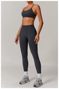 Detail of seamless charcoal grey yoga set featuring racerback top and high-waist leggings