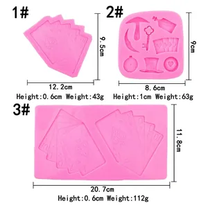 Pink silicone fondant molds featuring playing cards, clock, and key designs for DIY baking