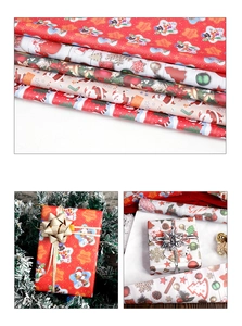 Detailed view of Christmas wrapping paper rolls and gift boxes with festive patterns