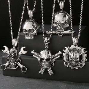 Mechanical punk skull pendants with wrench, pistol, and gear motifs in silver finish