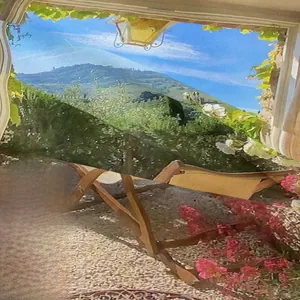 Detailed close-up showing mountain landscape printing and pink flowers on nature tapestry