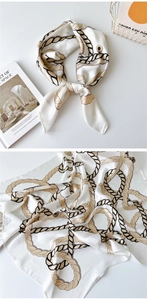 Detailed view of square silk scarf with classic rope print in an elegant French style