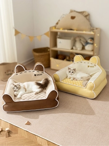 Close-up of soft plush pet sofa with WCAT logo and checkered pattern cushion detail