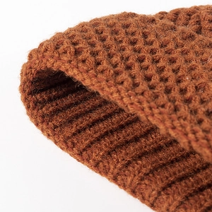 Minimalist brown pointed knit beanie for women featuring a thick textured wool finish