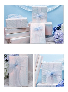 Macro detail of laser iridescent gift wrapping paper with blue honeycomb and crocodile textures
